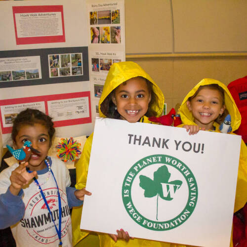 Group of Students Posing with WEGE Foundation Thank You Sign